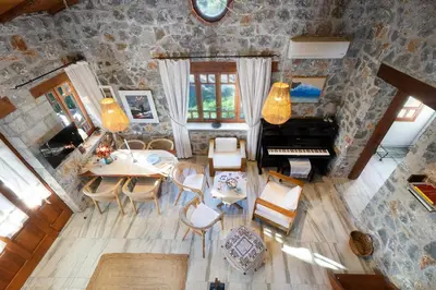 an aerial view of a living room with a piano at Fortino Villa in Chorafakia