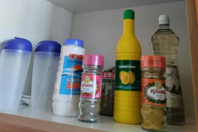 a shelf with bottles of food and condiments at Apartment - Sleeps 4 & Free Parking in Chania Town
