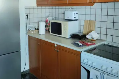a kitchen with a counter top with a microwave at Apartment - Sleeps 4 & Free Parking in Chania Town