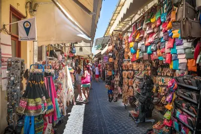 a group of people walking down a street in a market at Apartment - Sleeps 4 & Free Parking in Chania Town