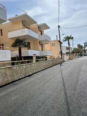 an empty street in front of a house at Kydonia apartments in Plataniás