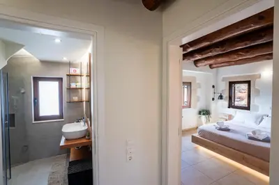 a bathroom with a bed and a shower and a sink at Villa Recluso-3 bd luxury country villa, huge heated pool with hydromassage, individual bbq & large yard, mountain view in Maláxa