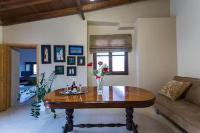 a living room with a table and a couch at Lefteris Holiday Home in Chania Town