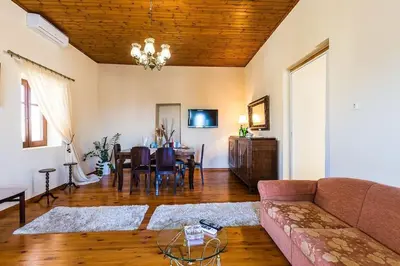 a living room with a couch and a table at Lefteris Holiday Home in Chania Town