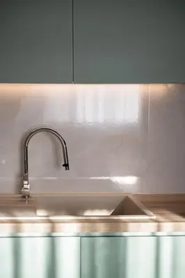 a kitchen sink with a faucet on top of it at Marita Luxury Apartment with parking space in Chania Town