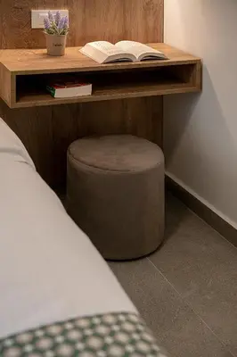 a wooden desk with a stool with a book on it at Casa D'Irene Apts in Chania Town