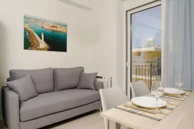 a living room with a couch and a table at EDEL Luxury Apartments in Chania Town