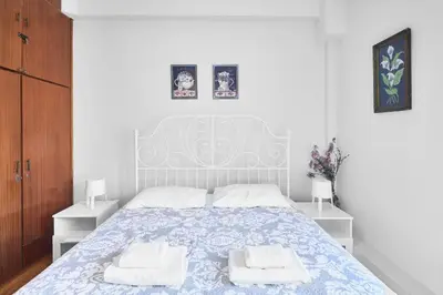 a bedroom with a bed with two towels on it at Angelina House in Chania Town