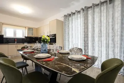 a dining room with a table and chairs at Villa panagiotis in Kissamos