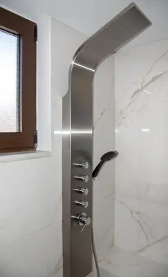 a shower in a bathroom with a glass door at Aretousa Home in Chania Town