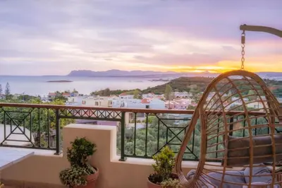 a balcony with a view of the ocean at Deja Blue Chania in Daratso