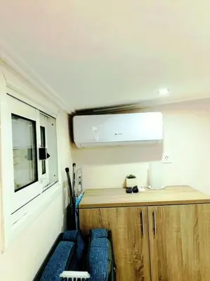 an rv with two chairs and a counter and a window at Ariadni's apartment 3 in Chania Town