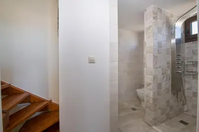 a bathroom with a shower and a toilet at Aretousa Studio in Chania Town
