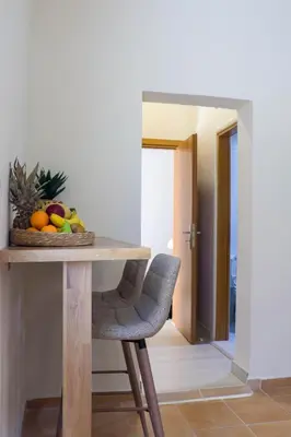 a table with a bowl of fruit on top of it at Hygge Home Chania in Chania Town