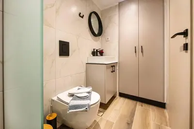 a bathroom with a toilet and a sink and a mirror at Ontas apartment in Kissamos in Kissamos