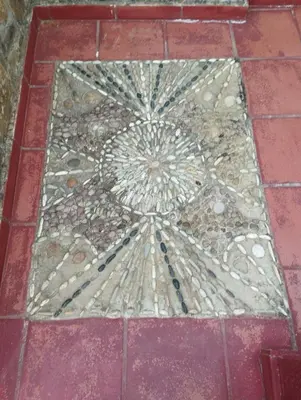 a tile floor with a stone design on it at Kastania..2 in Kiolianá