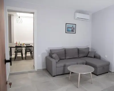 a living room with a couch and a table at Vesta suite&studio in Chania Old Town in Chania Town