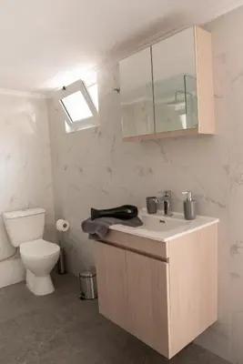 a bathroom with a sink and a toilet at Vesta suite&studio in Chania Old Town in Chania Town